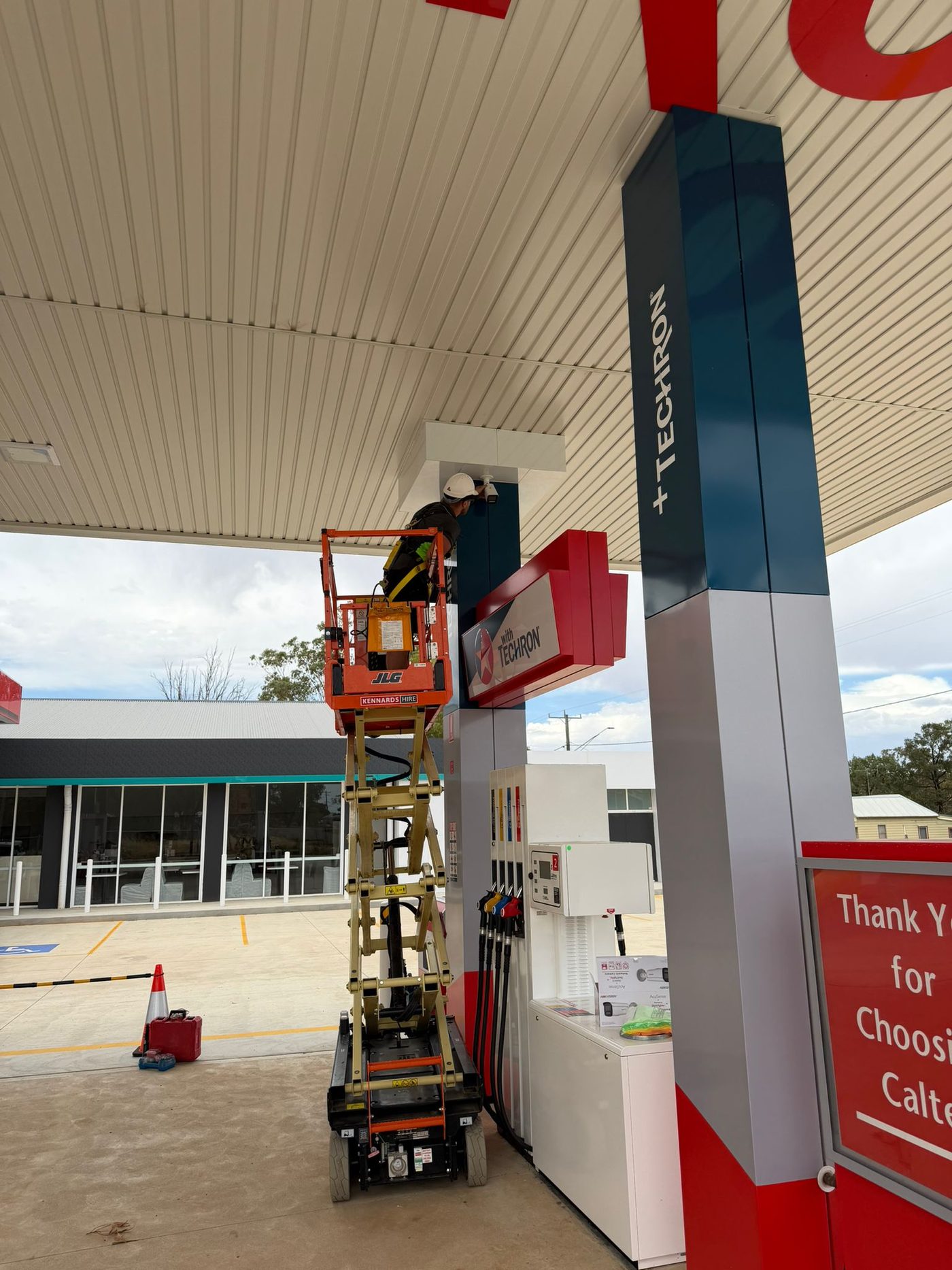 Caltex forecourt CCTV install from scissor lift