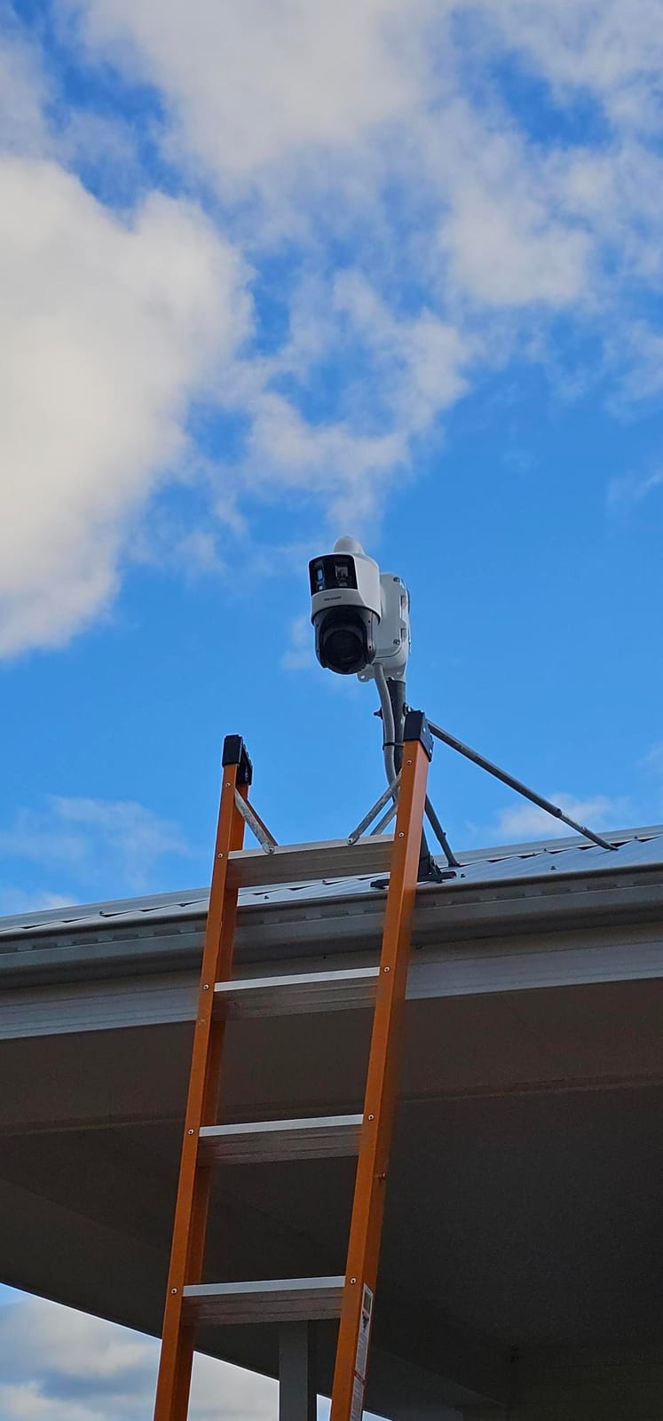 TandemVu PTZ security camera installed high on a farm building