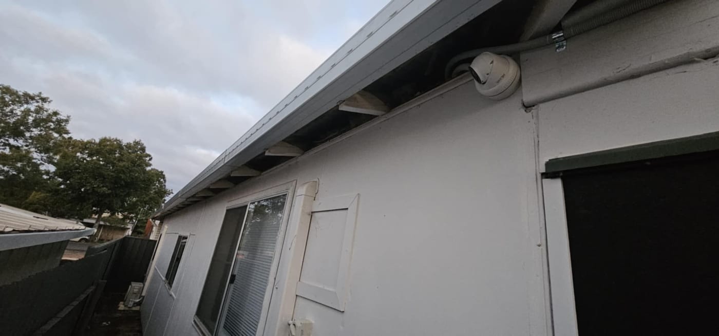 Residential CCTV camera installed beneath the roof eaves