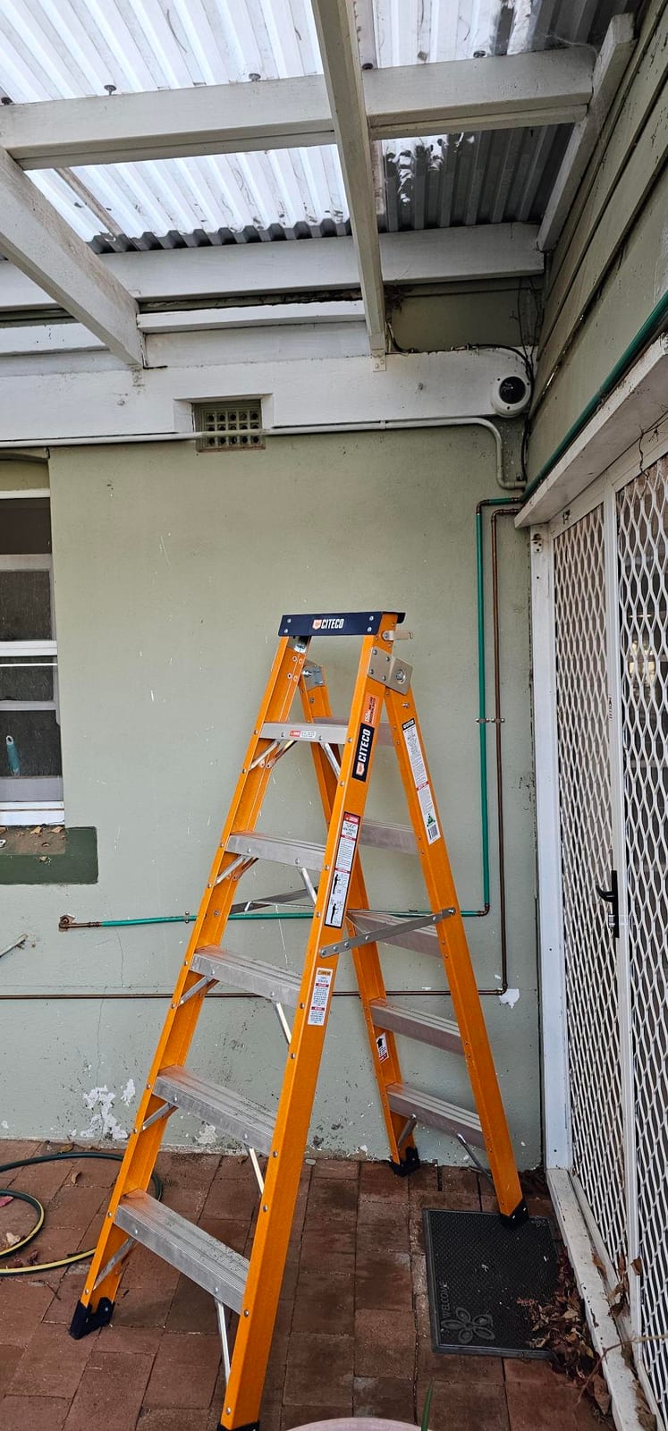Residential CCTV camera installed under a rear verandah